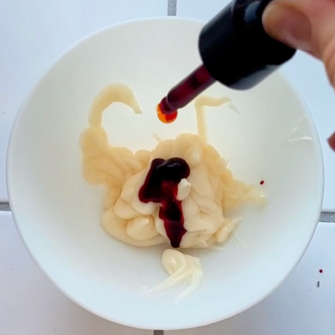 mixing a hair colour toner to make custom colored conditioner.